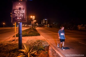Despite living 800km away, the Standard Bank IRONMAN African Championship is my home race. I well remember struggling along this part of Beach Road when I did the race a few years back. It’s almost cruel of the organisers to put up signs reminding the athletes how long the event is. The difficulty with photographing the moments of suffering, is that as soon as the guys see the camera, both thumbs come up, smiles reappear and the stride gets an extra jig in it. So when I get a shot like this, I know the subject is suffering so much he hasn’t noticed me.