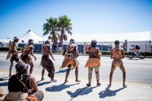 The race is an amalgam of various cultures. The one thing they all have in common is a desire to have fun and make the race a success. The local population are renowned worldwide for their support of the race and the athletes. To me, this photo epitomises what the race is all about.